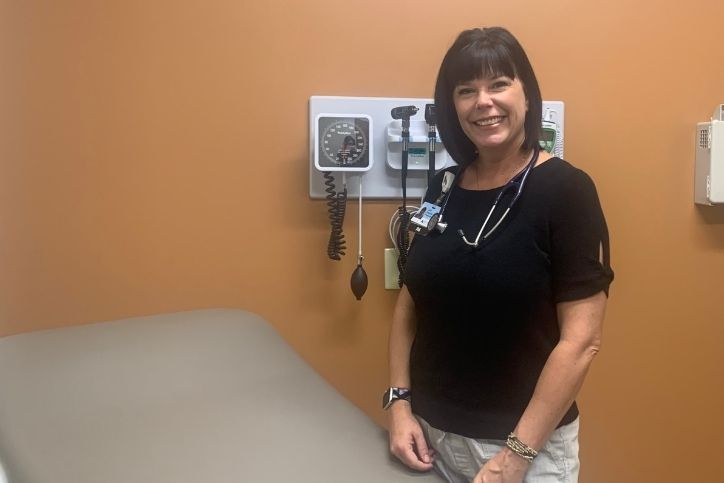 PA Lori Zwickel stands in patient room
